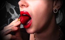 milf-mistress-with-red-lipstick-bites-into-strawberries
