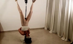 slave-in-upside-down-bondage-gets-fucked-deep-with-a-toy